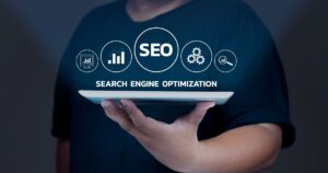 Person holding tablet with SEO icons representing local search optimization strategy for Kansas City