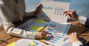 Marketing team analyzing PPC advertising performance charts and data to improve lead generation for Kansas City businesses