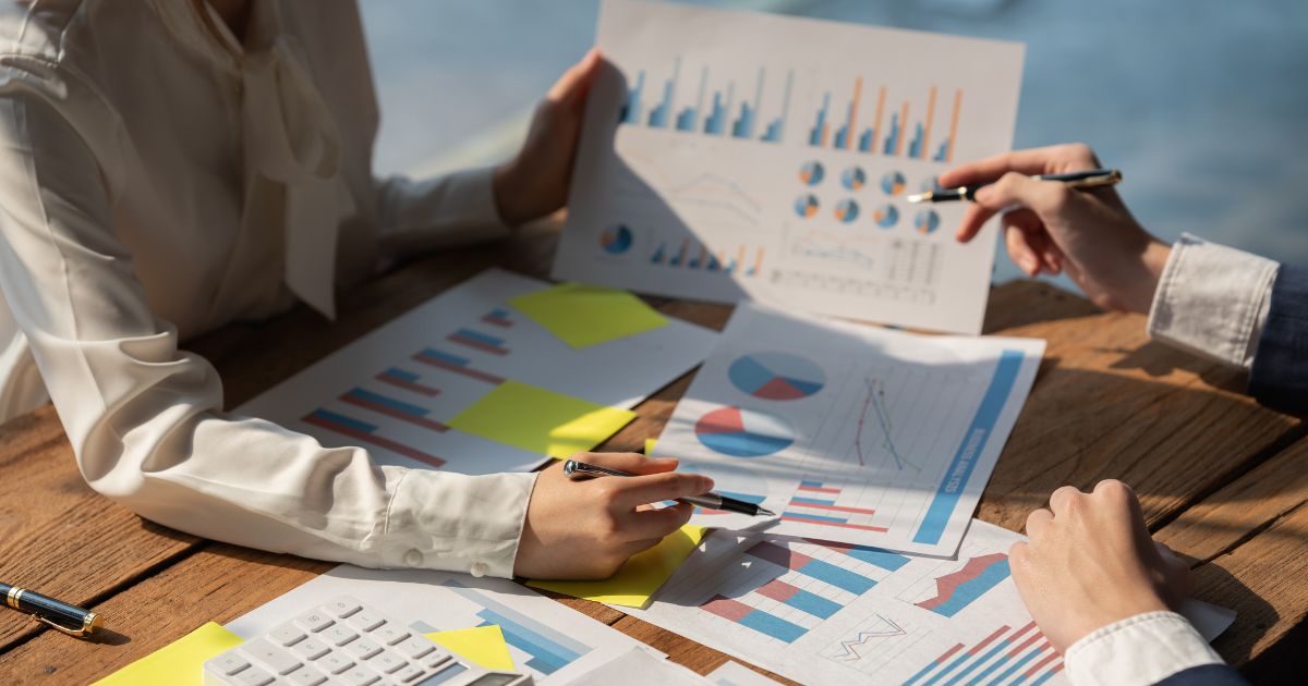 Marketing team analyzing PPC advertising performance charts and data to improve lead generation for Kansas City businesses