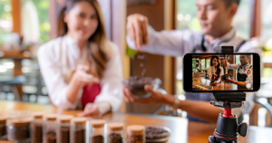 Small business creating video content on smartphone for social media marketing demonstrating video marketing strategies that improve engagement and business growth in Las Vegas.