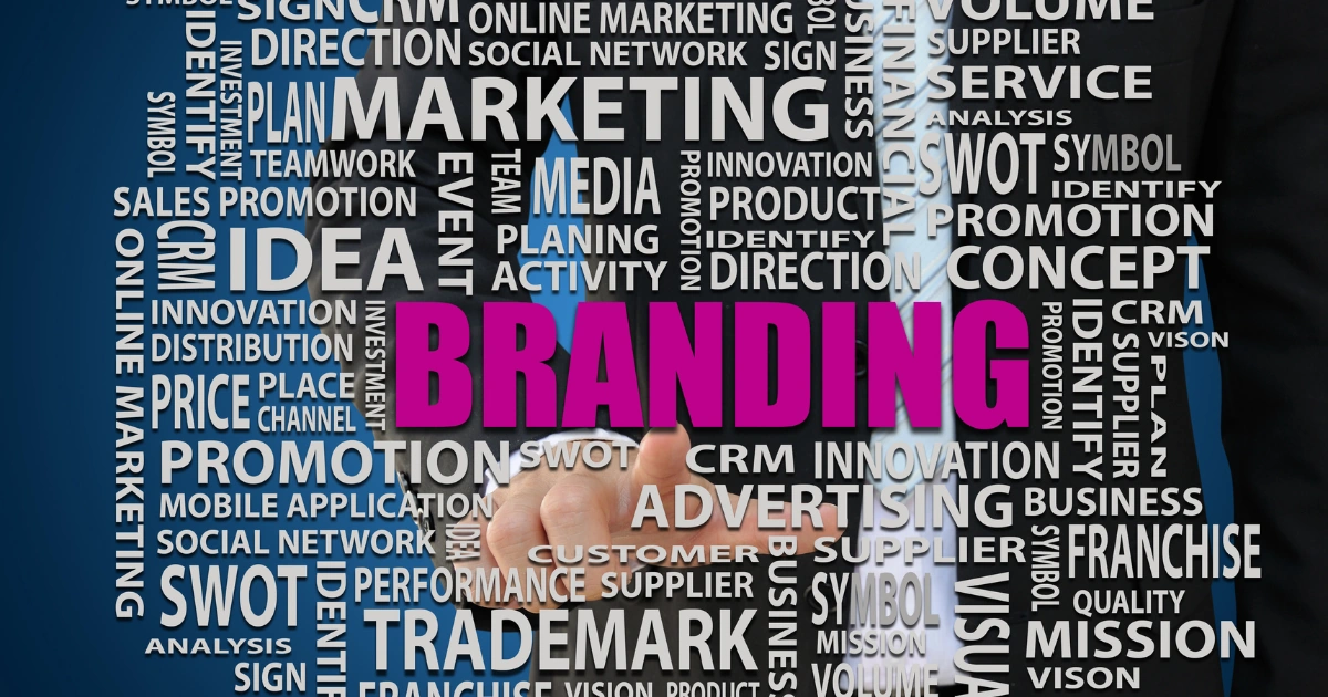 Businessman pointing at branding strategy surrounded by digital marketing keywords like SEO, CRM, and advertising