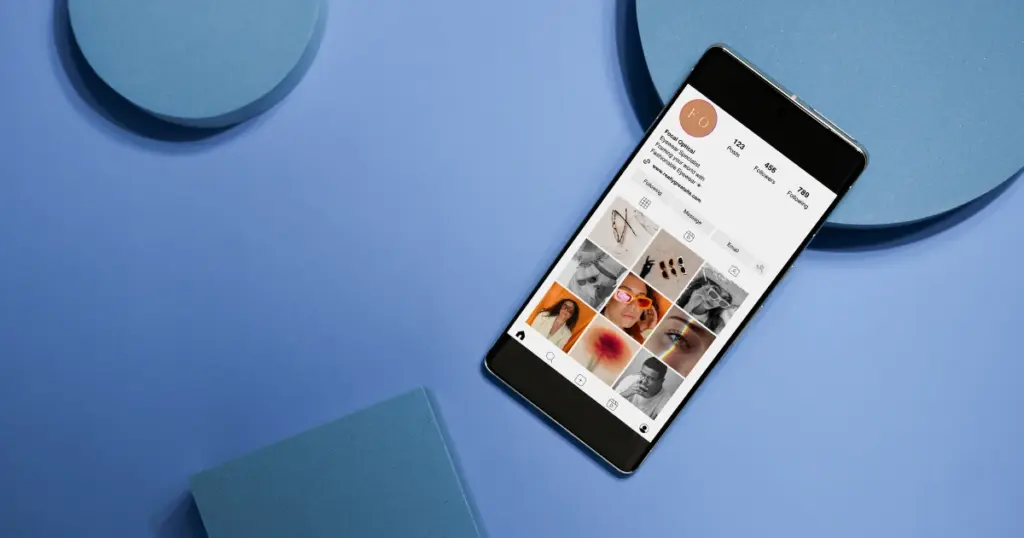 Smartphone displaying a curated Instagram profile layout on a blue background